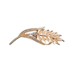 Elegant gold wheat ear brooch featuring cat's eye stones and sparkly rhinestones for women