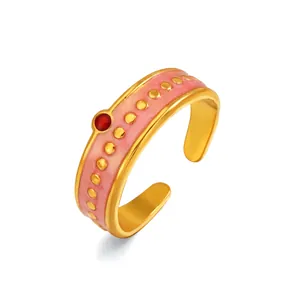 Elegante anillo de acero inoxidable con esmalte rosa, puntos dorados y piedra roja mujer