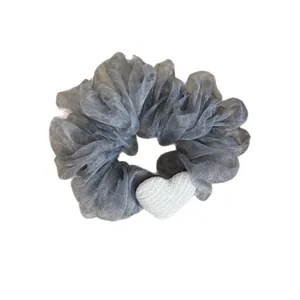 Elegant grey sheer textured scrunchie hair tie with a cute white heart accessory