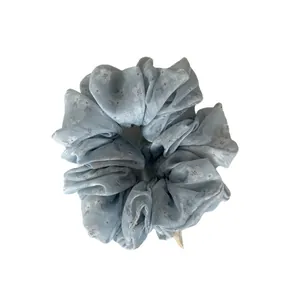 Elegant light blue floral scrunchie hair tie for bun and ponytail styling accessories