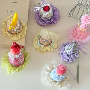 Detailed view of colorful Korean style mini birthday hat hair clips with bows and fruit decors