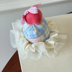 Detailed close-up of a Korean style mini hat hair clip with bow and white lace