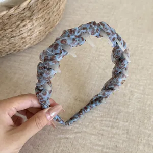 Detailed view of a light blue leopard print mesh headband with inner anti-slip teeth