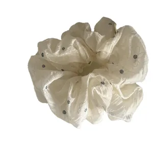 Elegant white scrunchie hair tie with blue chamomile flower embroidery for women hair styling