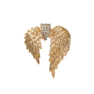 Elegant gold wing brooch with sparkling rhinestones for women's luxury fashion.