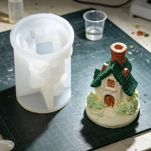 Detailed view of house silicone mold and finished resin cottage craft ornament