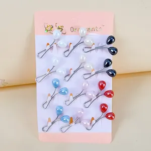 Detail of twelve colorful U-shaped scarf buckles featuring elegant faux pearl bead ends