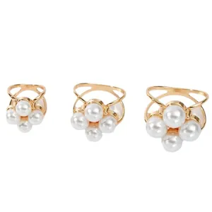 Three elegant gold-tone scarf buckles featuring clusters of white faux pearls