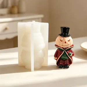 Detailed side-by-side view of the white silicone mold and the finished pumpkin gentleman candle