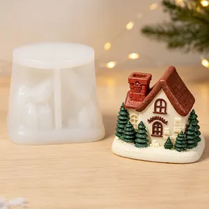 Silicone mold for Christmas miniature house ornament shown with finished plaster model