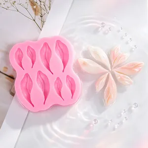 Detailed macro view showing pink silicone mold and translucent finished flower petals