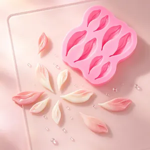 Detailed view of pink silicone mold with realistic flower petal designs for fondant