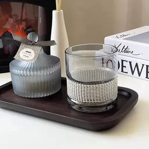 Luxury rhinestone-wrapped whiskey glass displayed in a cozy home lifestyle setting