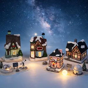 Detaillierte Ansicht leuchtender Weihnachtshäuser aus Harz unter einem funkelnden Sternenhimmel