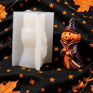 Detail view showing the silicone mold alongside a finished pumpkin wizard resin figure