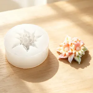 Detailed view of sunflower silicone mold beside a colorful finished aromatherapy flower