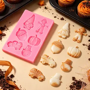 Detail shot of fall-themed silicone mold with finished pumpkin and gnome chocolates