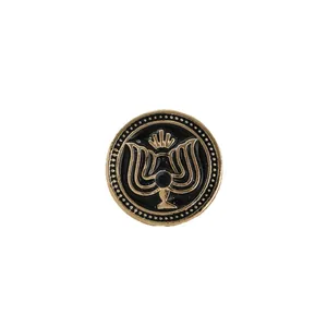 Elegant vintage gold and black enamel men's brooch pin with a stylized crest design