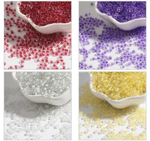 Detail view of colorful 2-4mm glass seed beads available in red, purple, clear, and yellow colors.