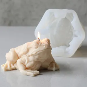 Detailed macro view of a frog silicone mold and its finished cream-colored candle.