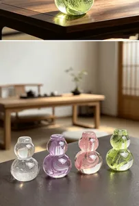 Detailed view of colorful crystal glass gourd teapot lid rests with bubble textures