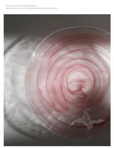 Close-up macro detail showing the pink ink-wash swirl pattern on a frosted glass fruit plate.