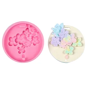 Detailed view of cherry blossom silicone mold and finished floral plaster pendant
