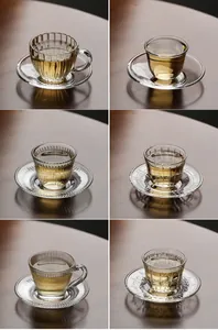 Detail view of six heat-resistant glass tea cups with different elegant textures
