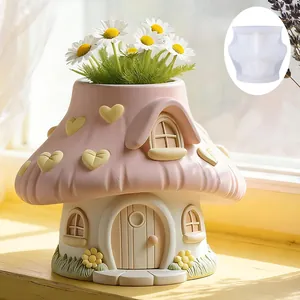 Detail view showing a finished decorative mushroom house planter alongside the silicone mold