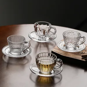 Set of four unique textured heat-resistant glass teacups and saucers for Kung Fu tea service