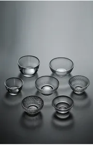 Collection of seven textured Japanese crystal glass tasting cups for tea and wine.