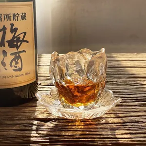 Japanese style textured glass tea cup with unique smoke pattern and matching glass saucer