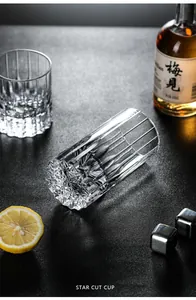 Detail view of premium hand-cut crystal whiskey glass with unique star cut base.