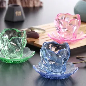 Set of vibrant colored smoke-patterned Japanese glass teacups with elegant matching saucers