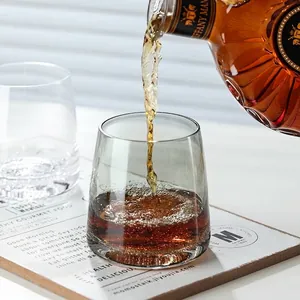 Elegant smoke grey whiskey glass with subtle bubbles, stylish Nordic water tumbler for home