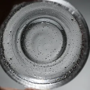Handmade clear glass bubble cup for whiskey and tea with a thickened round base