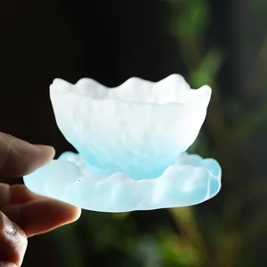 Elegant frosted glass teacup set with gradient blue wavy cloud saucer for tea ceremonies