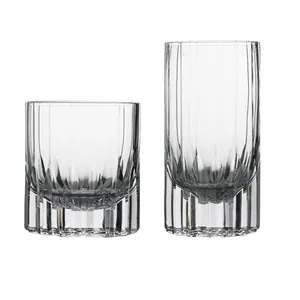 Hand-cut crystal whiskey and tall water glass set with vertical fluted patterns