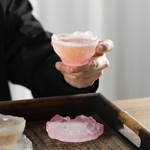 Premium handcrafted frosted pink glass tea cup featuring an irregular mountain-shaped rim