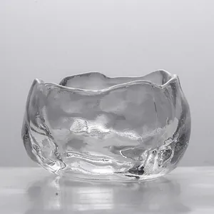 Close-up of a Japanese-style frosted glass tea cup with a unique frozen texture