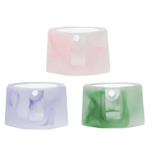 Elegant marbled colored glaze tea warmer candle bases in pink, purple, and green colors
