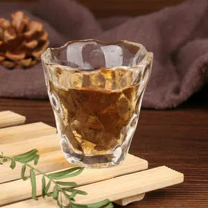 Japanese style hammered texture glass tea cup for Kung Fu tea ceremony on bamboo coaster