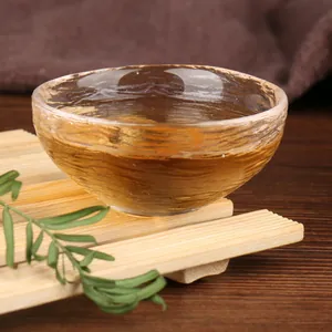 Authentic Japanese style hammered glass tea cup for Kung Fu tea ceremony on bamboo mat