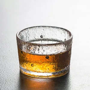 Japanese style hammered glass teacup with clear crystal texture for traditional tea ceremony
