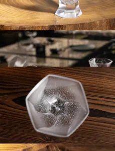 Macro view of handmade crystal glass tea cup with artistic star bubble pattern