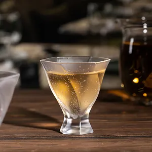 Exquisite handmade crystal glass tea cup with unique bubble texture on a rustic wooden table