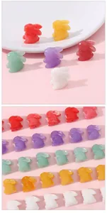 Detailed view of colorful resin rabbit charms arranged in rows for DIY jewelry making.