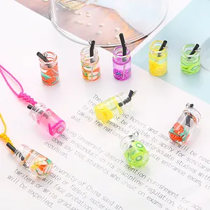 Detailed view of mini colorful fruit glass bottle charms for handmade DIY jewelry
