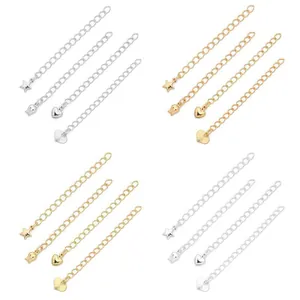 Detail view of 14K gold and silver jewelry extension chains with various charm ends