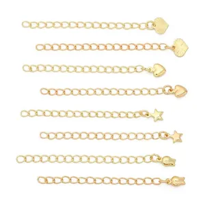 Detailed view of 14K gold-filled jewelry extension chains with heart and star charms